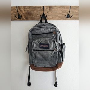 Jansport backpack gray with five compartments and faux leather bottom